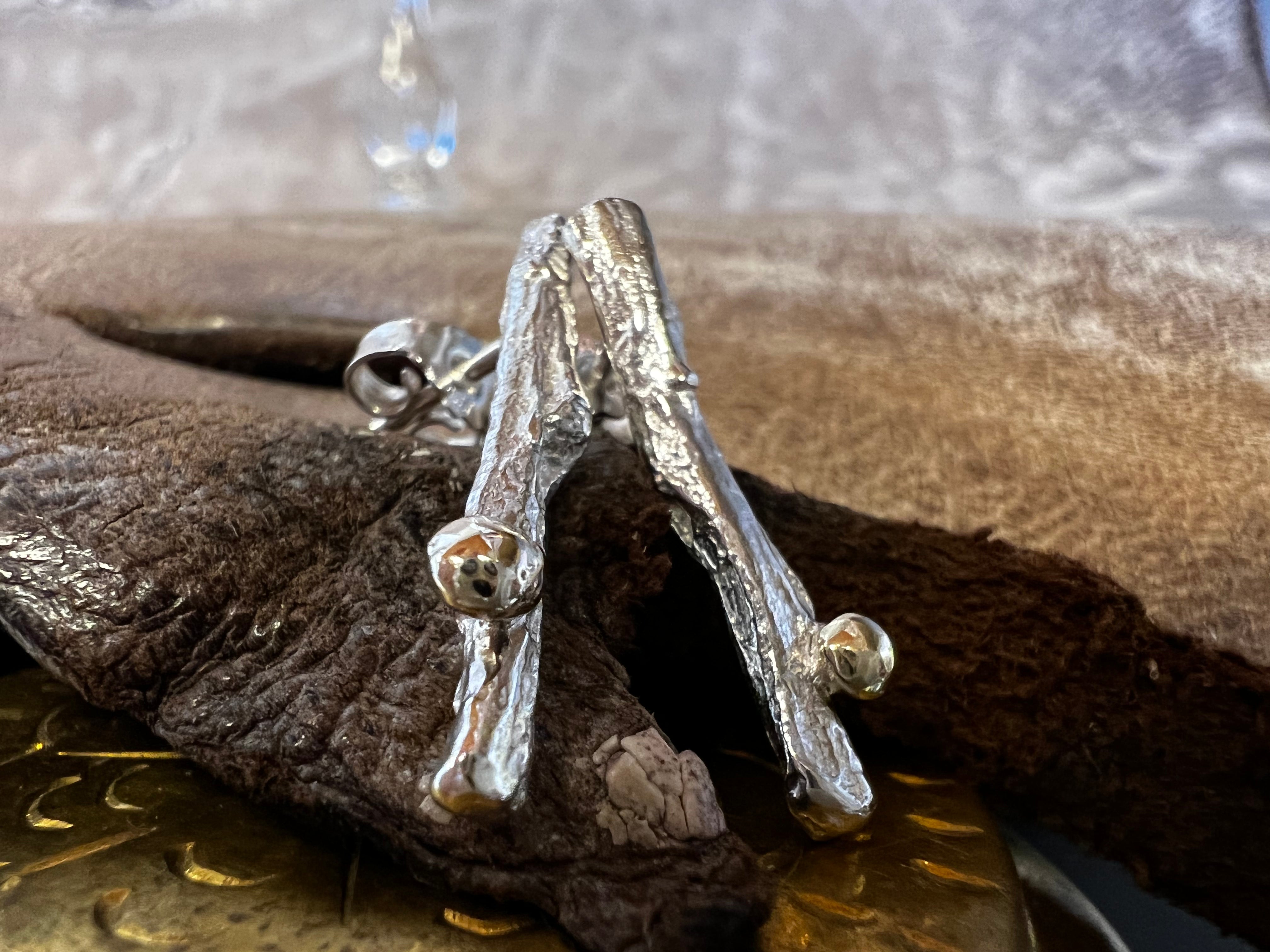 Havtorn ørestikke i sølv med guldkugler